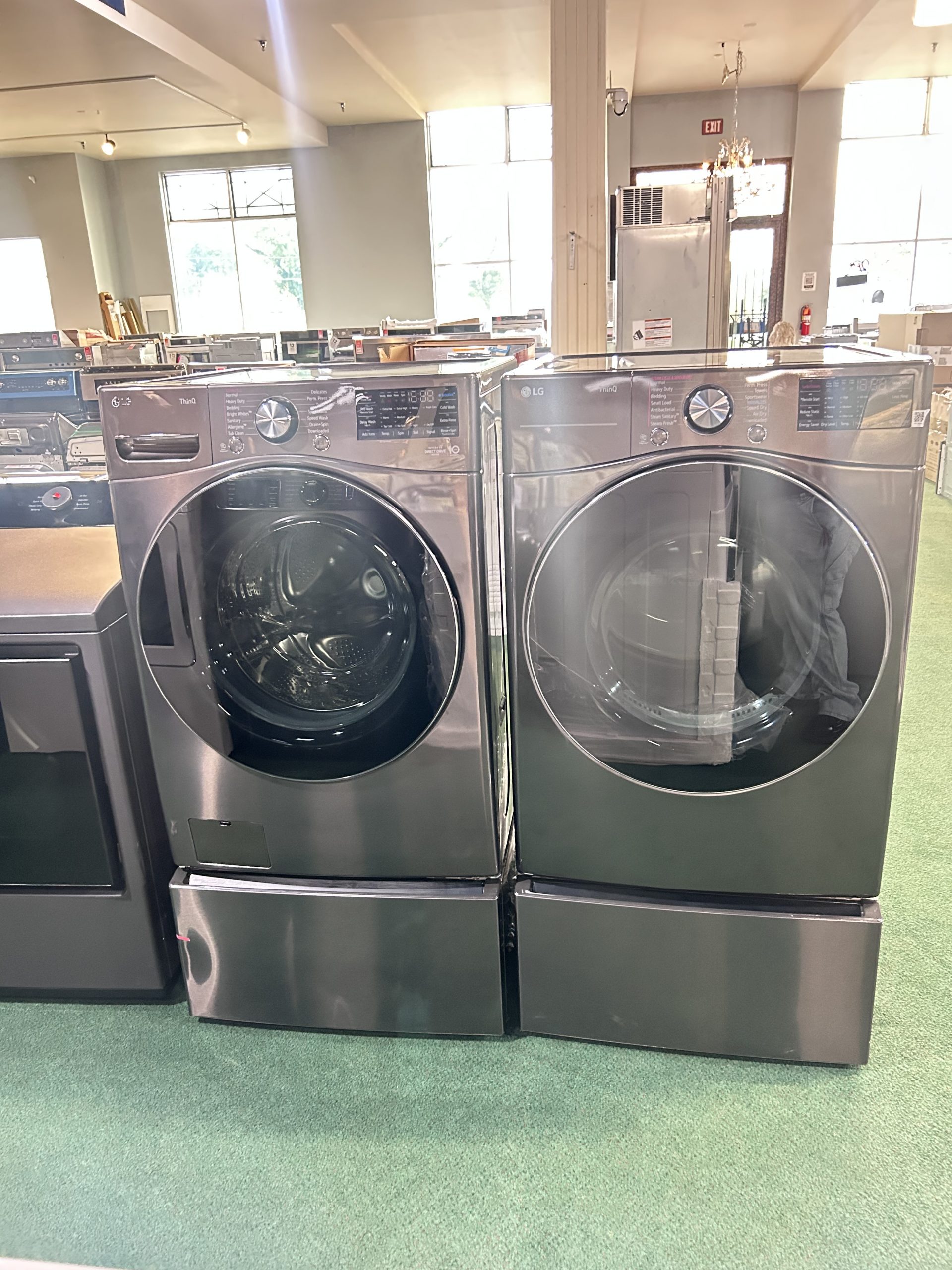 LG 27 Inch Wide 5 Cu. Ft. Front Load Washer and 7.4 Cu. Ft. Front Load Electric Dryer Laundry Pair with TurboSteam + 2 Pedestals