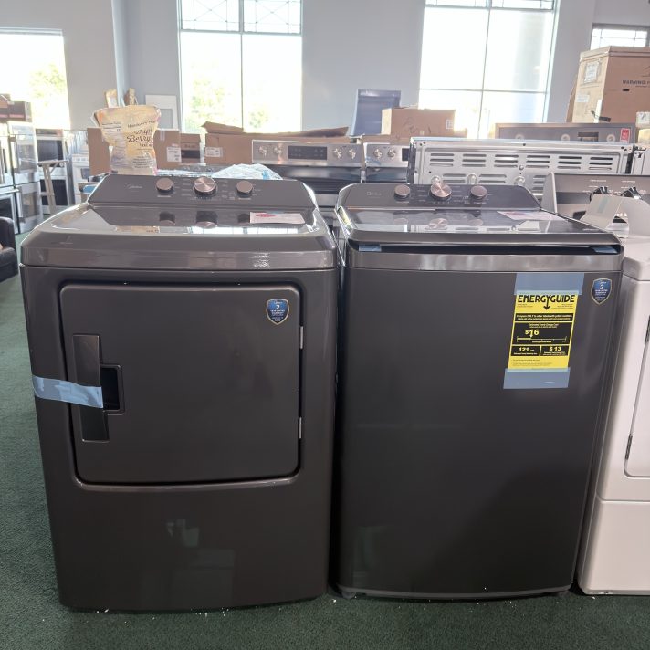Midea* Side-by-Side Top Load Washer and Gas Dryer Set in Metallic Grey